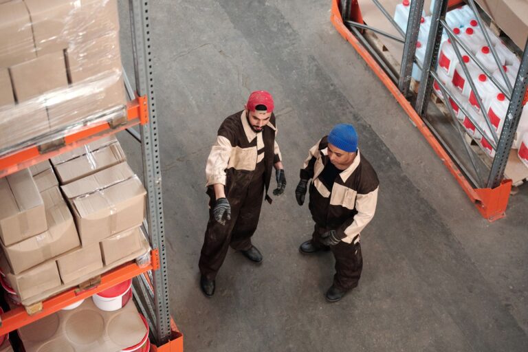 SME team members discussing operations inside a warehouse